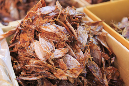 Dried Squid, traditional squids drying in the sun in a market Thailandの写真素材