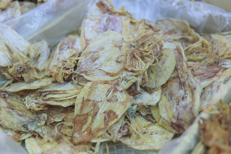 Dried Squid, traditional squids drying in the sun in a market Thailandの写真素材