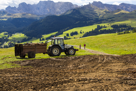 View of an agricultural tractor at work on a sunny dayのeditorial素材