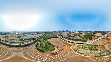 Aerial view of agricultural field and highway in the countryside in China.の写真素材
