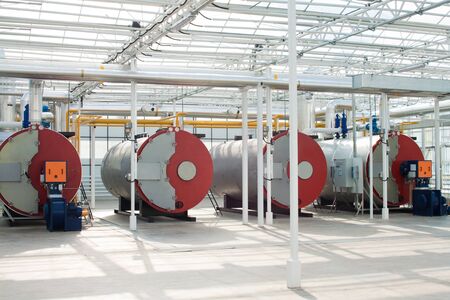 Row of industrial water boilers in a modern greenhouseの写真素材