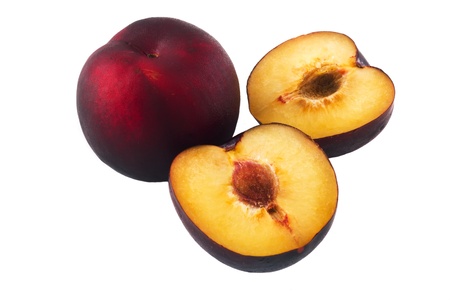 One compleat and two half of a plum isolated on white backgroundの写真素材