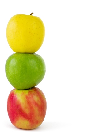 Vertical composition of three colorful apples, isolated on white backgroundの写真素材