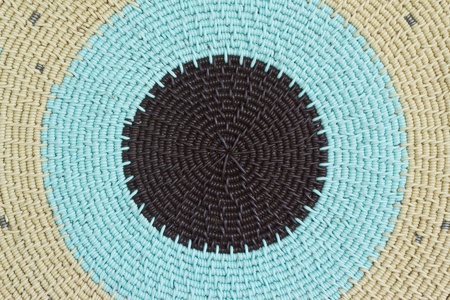 Close up photo  of hand-made plaited plate as a background の写真素材