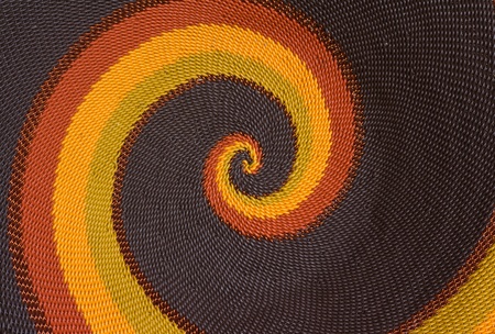 Close up photo  of hand-made plaited plate as a background の写真素材
