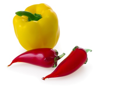 Natural yellow bell pepper and two glass red chili (chilli, chilly, chile) pepper isolated on white background.の写真素材