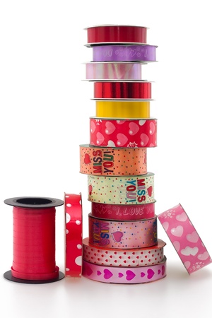 Stack of colorful ribbon collection isolated on white backgroundの写真素材