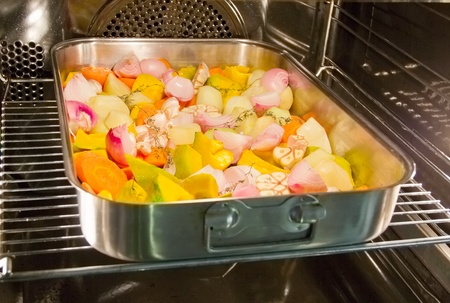 Oven roasted vegetables in the stainless steel  trayの写真素材