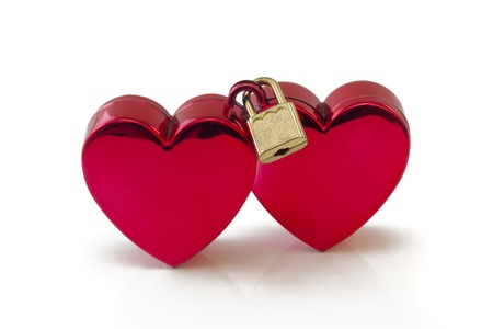 Two red hearts connected with padlock, isolated on white backgroundの写真素材