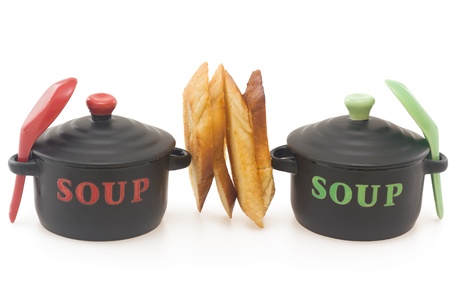 Two  soup casserole with crouton in between, isolated on white backgroundの写真素材