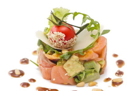 Avocado and salmon salad with small tomato  on topの写真素材