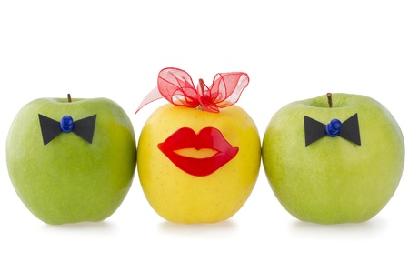 Three apples as a  concept of competition between two male over one female の写真素材