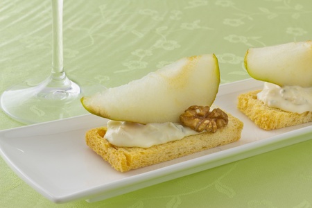 Two canap with blue cheese, slice of pear and walnut の写真素材