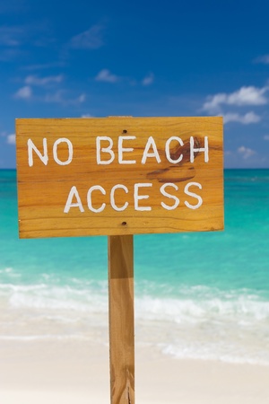 No beach access sign on beautiful background of sea, sky and beach の写真素材