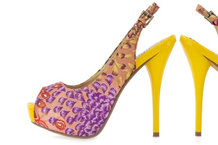Colorful yellow women stiletto shoes, isolated on white backgroundの写真素材