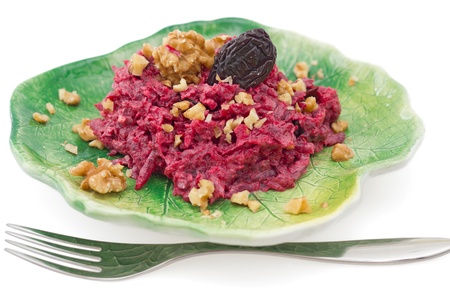 Beetroot salad with walnuts and prune on white backgroundの写真素材