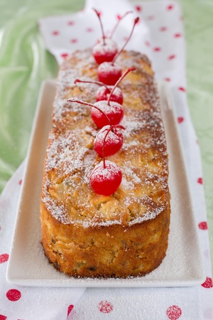 Close-up of homemade fruit cake with cherries decoration の写真素材