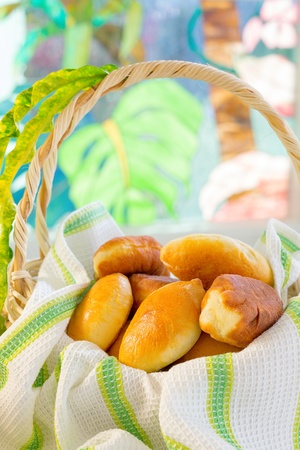 Freshly backed patties  pirogi  in the basket の写真素材