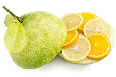 Green pomelo fruit cut, with segments of lemon and orange isolated on white background