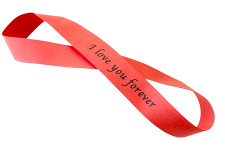 âI love you foreverâ sigh on red tape in shape of infinity, isolated on whiteの写真素材