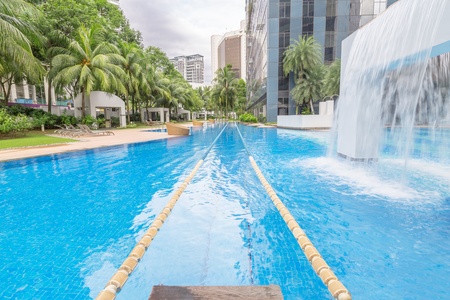 Swimming pool with swimming path and cozy chair on sideのeditorial素材