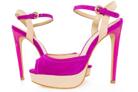 Pair of beautiful pink and beige  high hilled shoes, isolated on white backgroundの写真素材