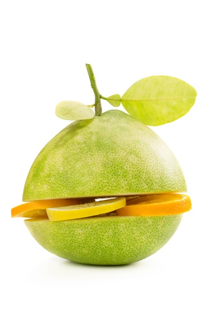 Green pomelo fruit cut with segments of lemon and orange isolated on white Backgroundの写真素材