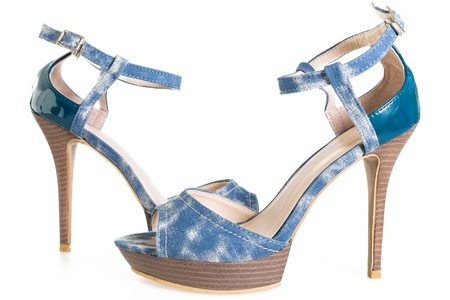 Pair of denim stiletto shoes isolated on white backgroundの写真素材