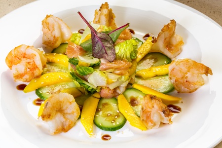 Prawn salad with mango, smock salmon, cucumber, balsamic vinegar and toasted  sesame seeds の写真素材