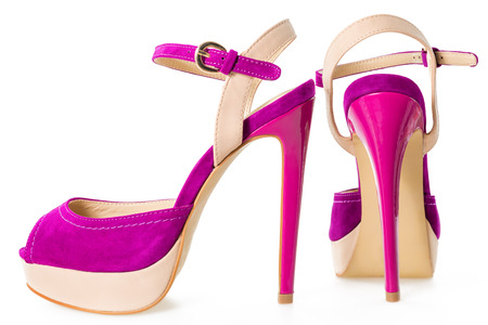 Pair of beautiful pink and beige  high hilled shoes, isolated on white backgroundの写真素材