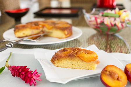 Slice of plum cake on square plateの写真素材