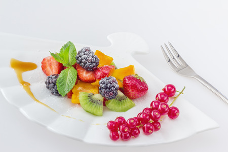 Diet, healthy colorful fruit salad in the white plateの写真素材
