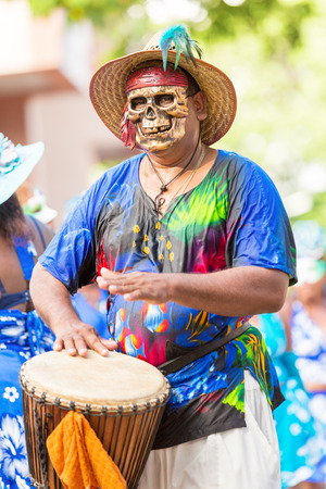 VICTORIA, SEYCHELLES â April 26, 2014: Local men in Death mask  at the Carnival International de Victoria in Seychellesのeditorial素材