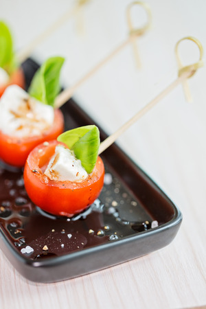 Mini caprese finger food appetizers, with tomato and mozzarellaの写真素材