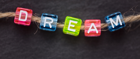 DREAM word concept on dark backgroundの写真素材