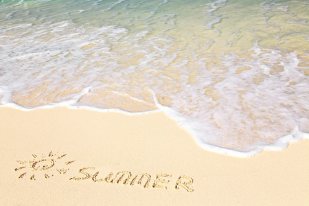 Word SUMMER on beach - vacation concept backgroundの写真素材