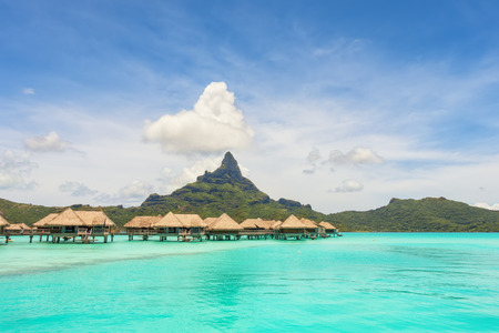 Over water bungalows into amazing green lagoon at Bora Bora islandの写真素材
