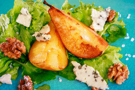 Green salad with caramelised pears,walnuts and blue cheeseの写真素材