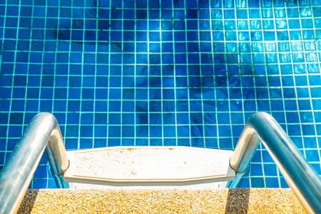 Swimming pool with stair and handrailの写真素材
