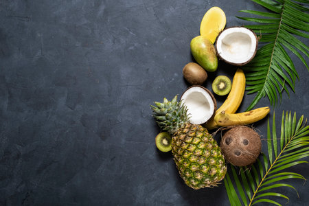 Mix Tropical fruit on dark background, top view. Healthy eating , Nutrition and  diet concept