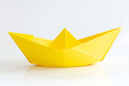 Yellow Paper boat isolated on white backgroundの写真素材