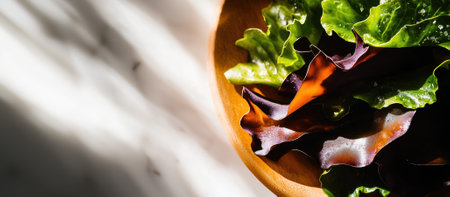 An ultra-detailed close-up of crispy seaweed chips reveals intricate textures and tiny salt crystals. The shot captures deep green hues with highlights, set against a soft, warm background.の素材