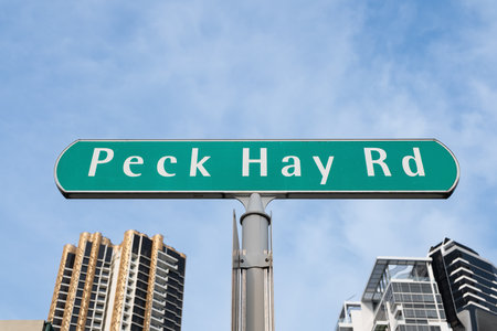 Singapore, Singapore - May 01, 2025: Peck Hay Road street sign in Singapore with contemporary buildings in the backgroundの写真素材