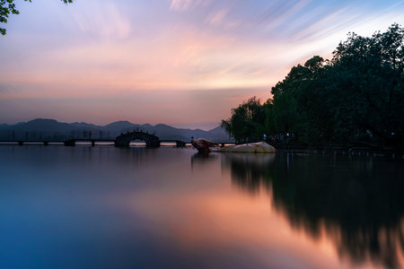 Sunset over the lake in Hangzhou, China. Long exposure