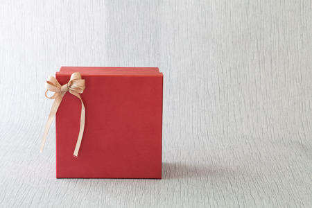 red gift box for someone special on wood background