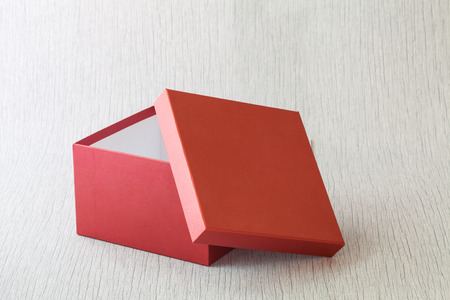 red gift box for someone special on wood background
