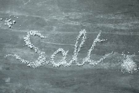 salt word on table topview stone backgroundの写真素材