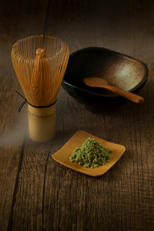 green tea matcha japanese drink traditional with wood background and hot smoke from teaの写真素材
