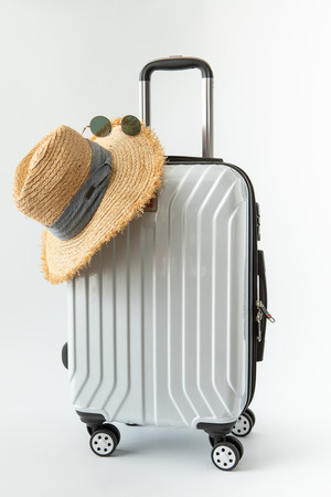 white luggage hat travel journey to destination long weekend holiday on white backgroundの写真素材