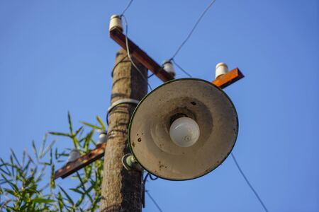 Old photo lamp on telephone poleの写真素材